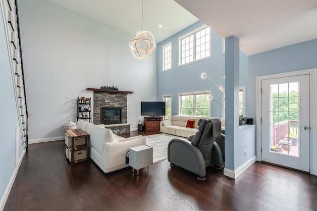 45 Jeffrey Dr, Pleasant Valley, NY 12569 - living room with dark wood-style floors, a chandelier, a stone fireplace, and a towering ceiling
