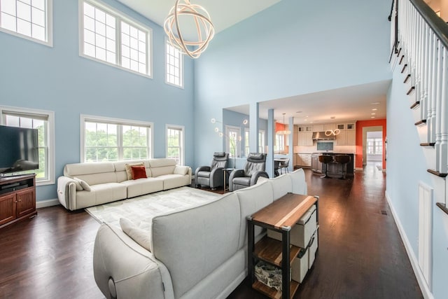 45 Jeffrey Dr, Pleasant Valley, NY 12569 - living room with dark wood-style floors, a towering ceiling, and a chandelier