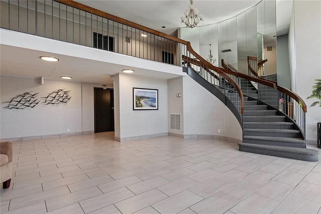 210-19 26th Ave Unit 3F, Bayside, NY 11360 - stairs featuring a high ceiling and a chandelier