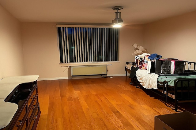 210-19 26th Ave Unit 3F, Bayside, NY 11360 - bedroom featuring wood finished floors and baseboards