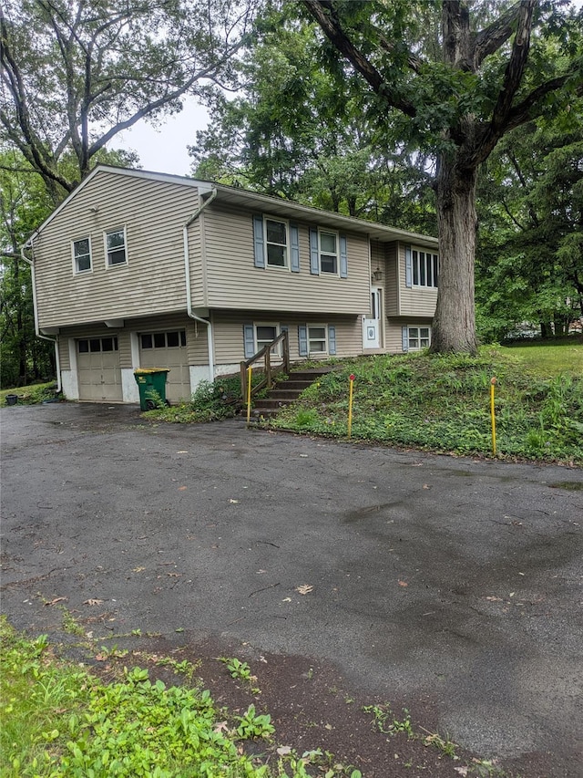 24 Delilah Ln, Plattekill, NY 12589 - bi-level home with a garage and asphalt driveway