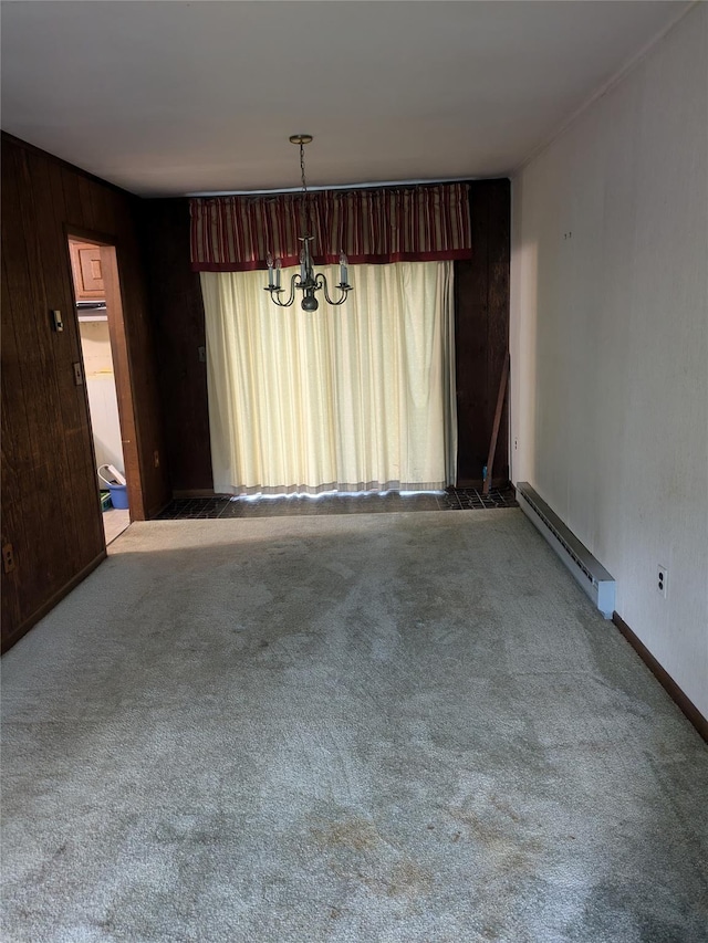 24 Delilah Ln, Plattekill, NY 12589 - carpeted spare room featuring a baseboard heating unit, a chandelier, and wood walls