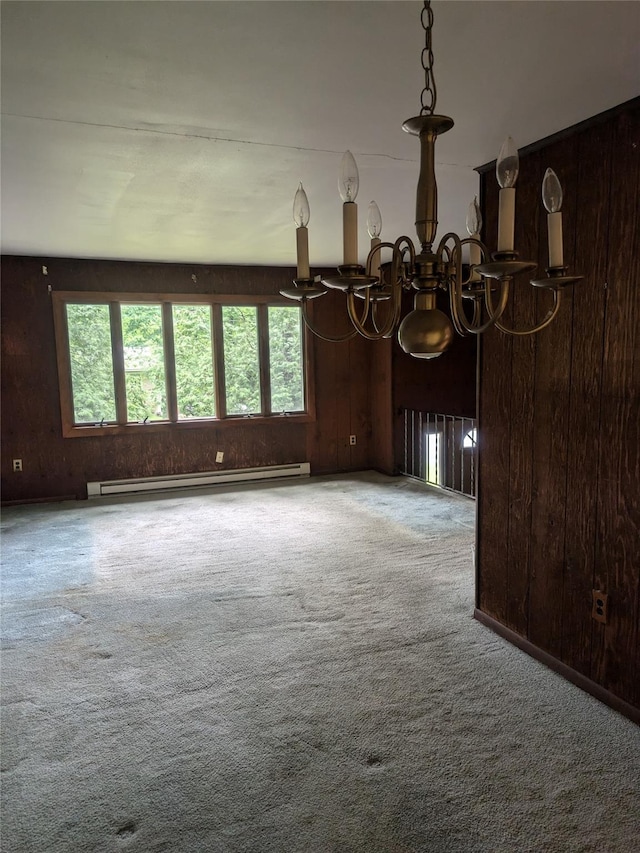 24 Delilah Ln, Plattekill, NY 12589 - spare room featuring baseboard heating, a chandelier, carpet, and wooden walls