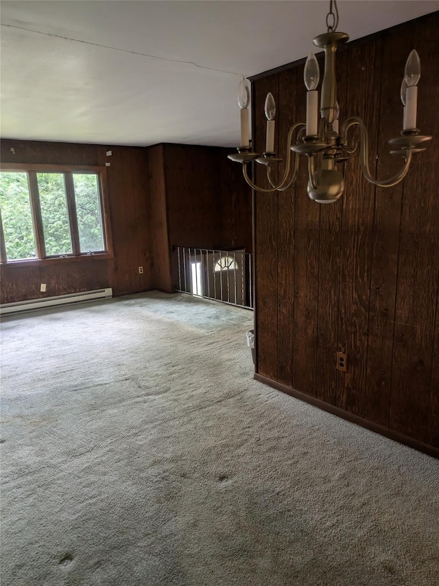 24 Delilah Ln, Plattekill, NY 12589 - unfurnished room with baseboard heating, carpet, a chandelier, and wooden walls