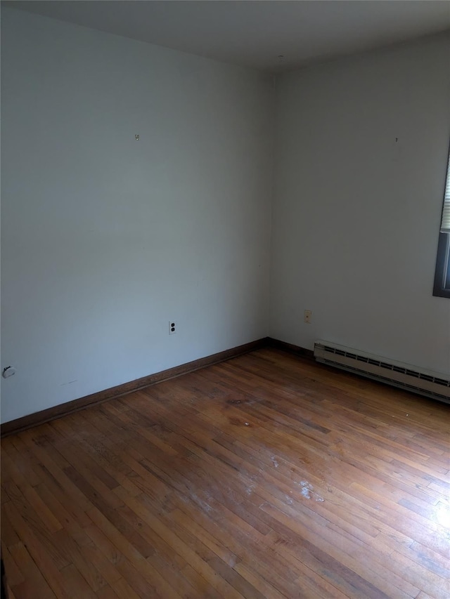 24 Delilah Ln, Plattekill, NY 12589 - unfurnished room featuring dark wood-style flooring and baseboard heating