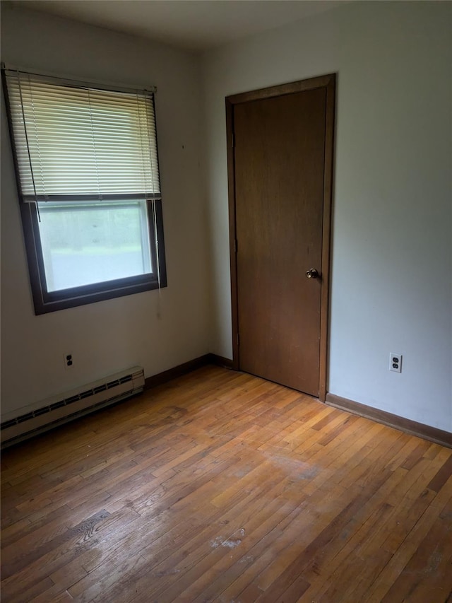 24 Delilah Ln, Plattekill, NY 12589 - unfurnished room with baseboard heating and hardwood / wood-style flooring