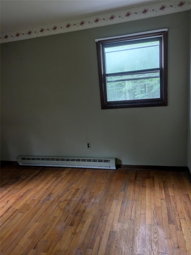 24 Delilah Ln, Plattekill, NY 12589 - empty room with a baseboard radiator and wood finished floors