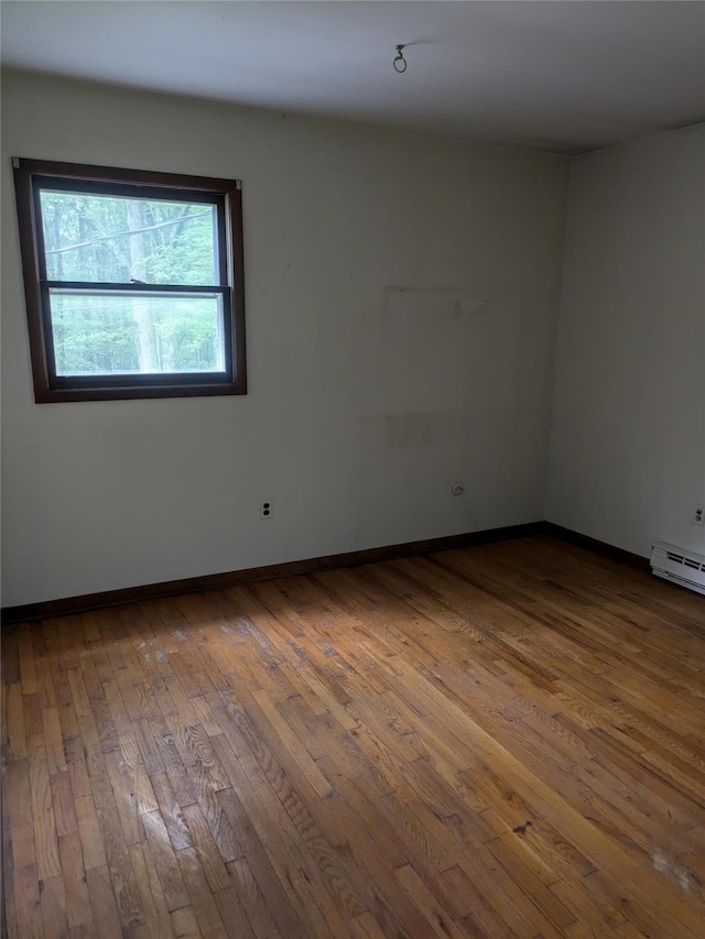 24 Delilah Ln, Plattekill, NY 12589 - spare room featuring hardwood / wood-style floors and a baseboard radiator