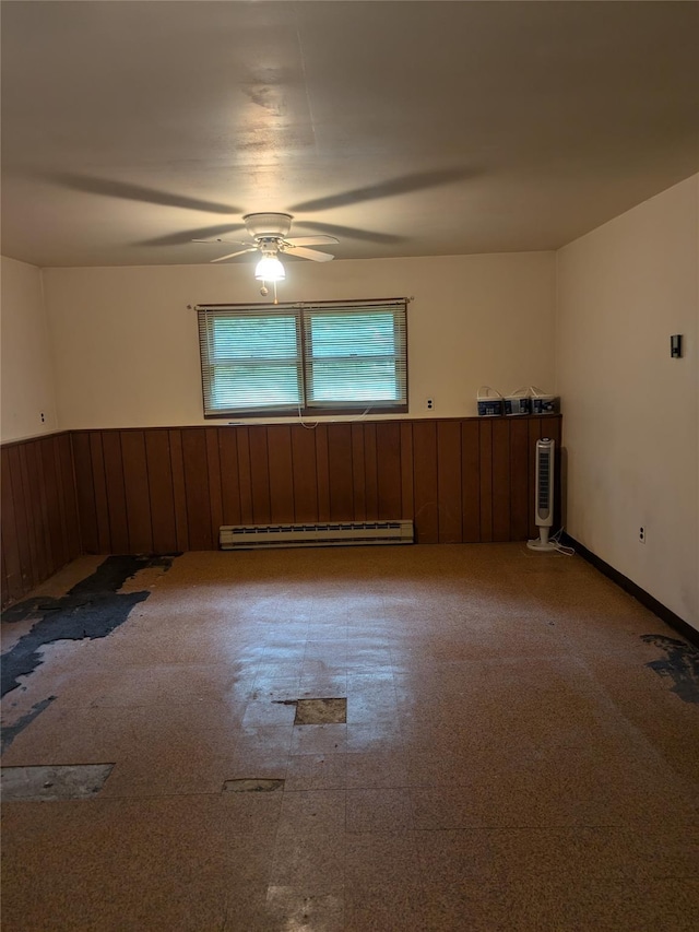 24 Delilah Ln, Plattekill, NY 12589 - spare room with baseboard heating, ceiling fan, and wooden walls