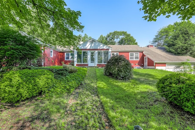 627 Haverstraw Rd, Airmont, NY 10901 - back of property with a chimney and a yard