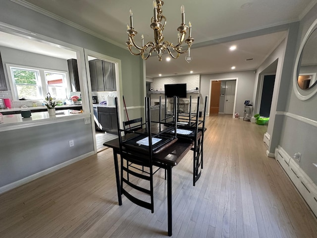 627 Haverstraw Rd, Airmont, NY 10901 - dining space featuring ornamental molding, light wood finished floors, recessed lighting, and a chandelier