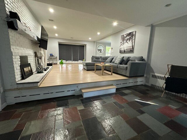 627 Haverstraw Rd, Airmont, NY 10901 - living room featuring a brick fireplace and recessed lighting