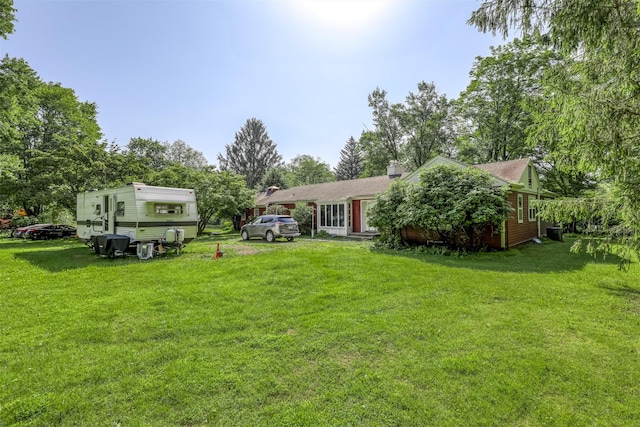 627 Haverstraw Rd, Airmont, NY 10901 - rear view of house featuring a lawn