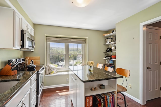 55 Winterberry Cir, Cross River, NY 10518 - kitchen with open shelves, appliances with stainless steel finishes, white cabinets, a breakfast bar area, and dark wood finished floors