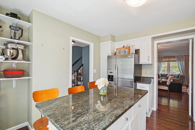 55 Winterberry Cir, Cross River, NY 10518 - kitchen featuring stainless steel fridge with ice dispenser, white cabinetry, dark wood-style flooring, a center island, and dark stone countertops