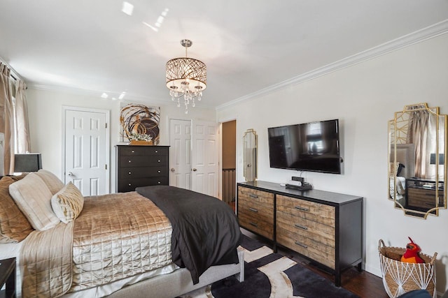 55 Winterberry Cir, Cross River, NY 10518 - bedroom with multiple closets, ornamental molding, a chandelier, and dark wood-style flooring