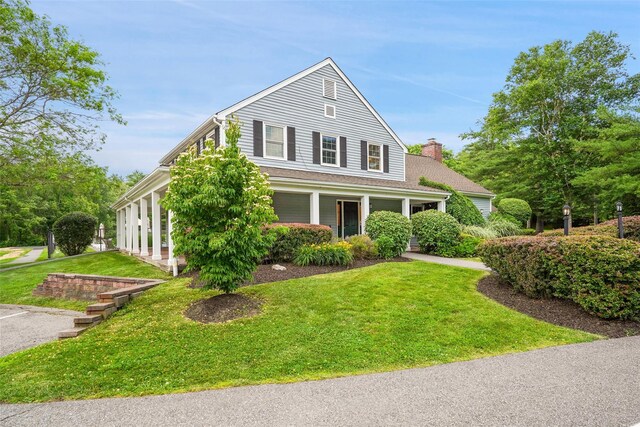55 Winterberry Cir, Cross River, NY 10518 - view of front facade featuring a front yard and a chimney