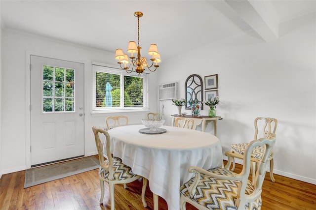 318 W Cortland Ave, Oceanside, NY 11572 - dining room featuring a chandelier, hardwood / wood-style floors, and a wall mounted AC