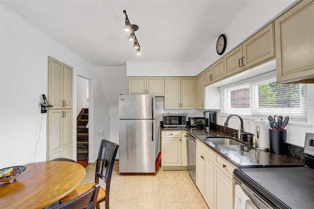 318 W Cortland Ave, Oceanside, NY 11572 - kitchen with appliances with stainless steel finishes, cream cabinetry, and light tile patterned flooring