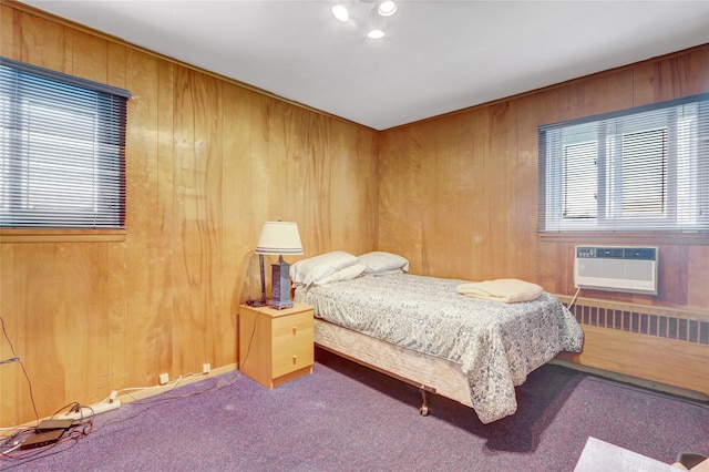 318 W Cortland Ave, Oceanside, NY 11572 - bedroom with wood walls and carpet floors