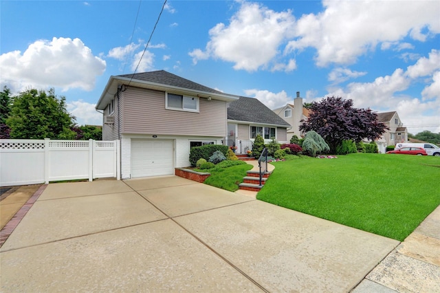 318 W Cortland Ave, Oceanside, NY 11572 - split level home with driveway, a garage, and a shingled roof