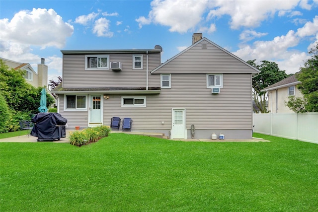 318 W Cortland Ave, Oceanside, NY 11572 - rear view of property featuring a chimney and a patio area