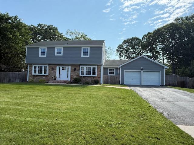 71 Strathmore Village Dr, South Setauket, NY 11720 - colonial house featuring driveway, a garage, and stone siding