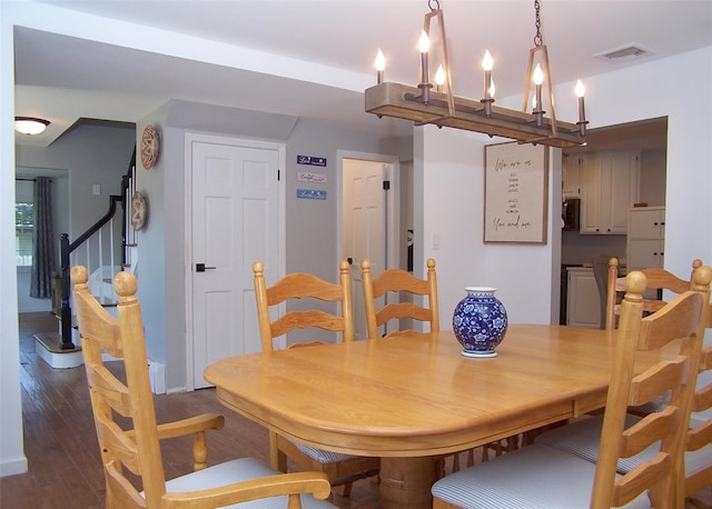 71 Strathmore Village Dr, South Setauket, NY 11720 - dining room featuring wood finished floors and baseboards