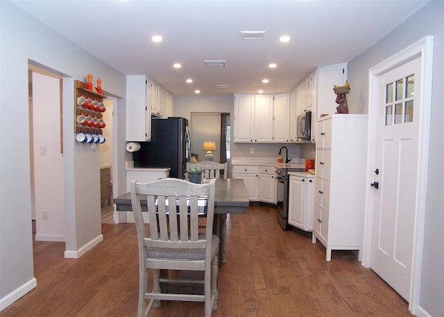 71 Strathmore Village Dr, South Setauket, NY 11720 - kitchen featuring electric range oven, freestanding refrigerator, white cabinetry, dark wood-style floors, and light countertops