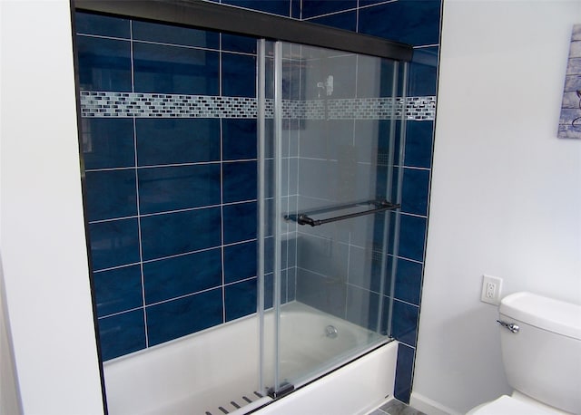 71 Strathmore Village Dr, South Setauket, NY 11720 - bathroom featuring toilet and bath / shower combo with glass door