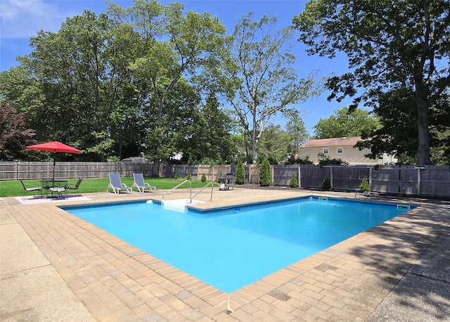 71 Strathmore Village Dr, South Setauket, NY 11720 - view of swimming pool featuring a patio area and a fenced backyard