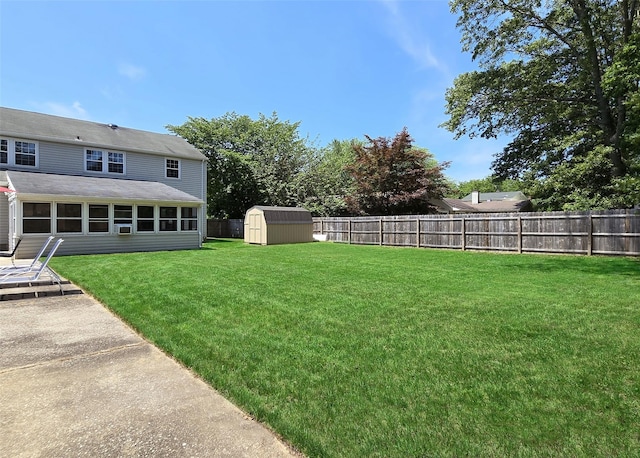 71 Strathmore Village Dr, South Setauket, NY 11720 - fenced backyard with a storage unit and a patio area