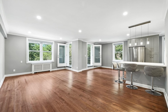 1133 Midland Ave Unit 4E, Bronxville, NY 10708 - unfurnished living room featuring radiator, recessed lighting, dark wood finished floors, and ornamental molding