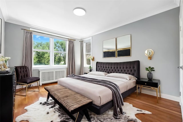 1133 Midland Ave Unit 4E, Bronxville, NY 10708 - bedroom with radiator, ornamental molding, and light wood-style flooring