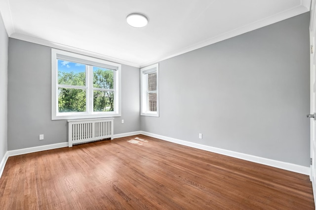 1133 Midland Ave Unit 4E, Bronxville, NY 10708 - unfurnished room with radiator heating unit, ornamental molding, and wood finished floors