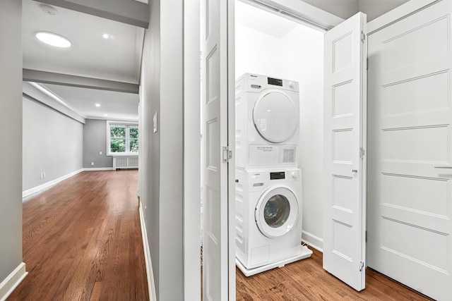 1133 Midland Ave Unit 4E, Bronxville, NY 10708 - washroom with stacked washing machine and dryer and wood finished floors