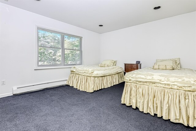 41 N Quince Ln, Monsey, NY 10952 - bedroom with a baseboard heating unit and dark colored carpet