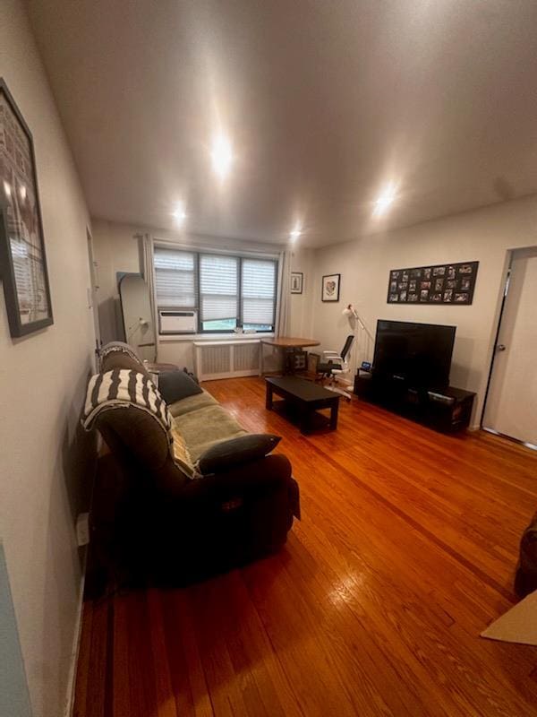 141 Wyckoff Pl Unit 1F, Woodmere, NY 11598 - living area with wood finished floors and radiator