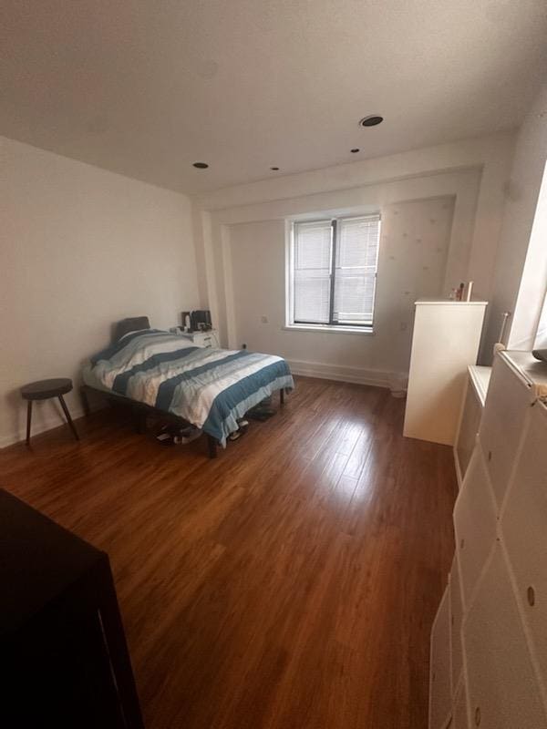 141 Wyckoff Pl Unit 1F, Woodmere, NY 11598 - bedroom featuring wood finished floors and baseboards
