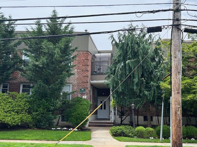 257 Cedarhurst Ave Unit A 8, Cedarhurst, NY 11516 - obstructed view of property featuring brick siding