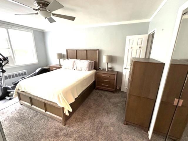 257 Cedarhurst Ave Unit A 8, Cedarhurst, NY 11516 - bedroom with ornamental molding, dark carpet, ceiling fan, and radiator heating unit