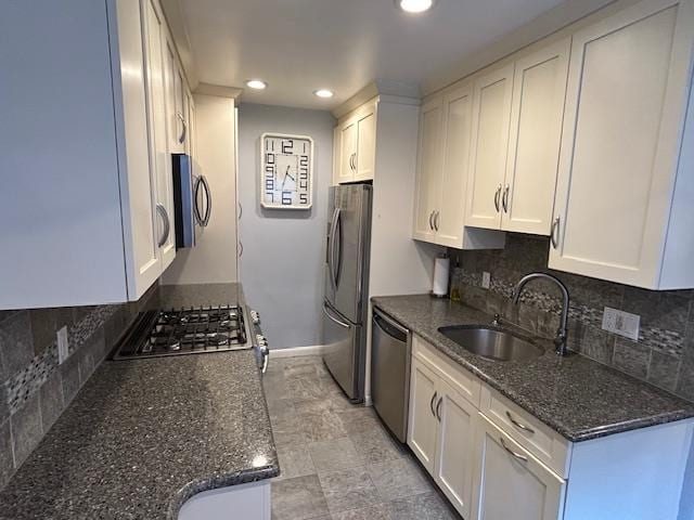 257 Cedarhurst Ave Unit A 8, Cedarhurst, NY 11516 - kitchen with stainless steel appliances, white cabinetry, dark stone counters, and recessed lighting