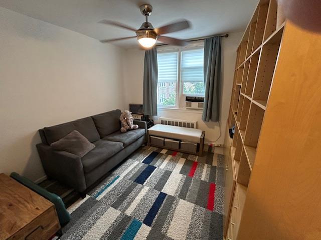 257 Cedarhurst Ave Unit A 8, Cedarhurst, NY 11516 - living room with ceiling fan, radiator, and cooling unit