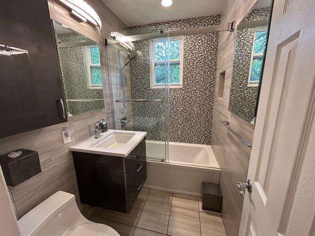 257 Cedarhurst Ave Unit A 8, Cedarhurst, NY 11516 - bathroom with tile patterned flooring, shower / bath combination with glass door, and vanity