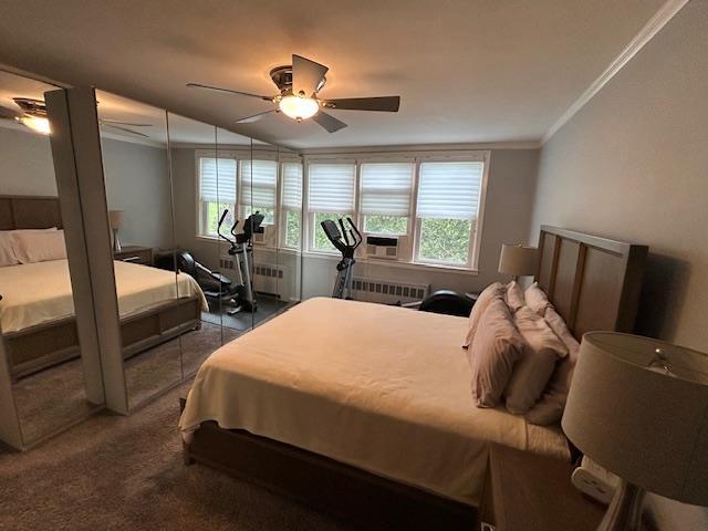 257 Cedarhurst Ave Unit A 8, Cedarhurst, NY 11516 - bedroom with crown molding, cooling unit, ceiling fan, carpet flooring, and radiator