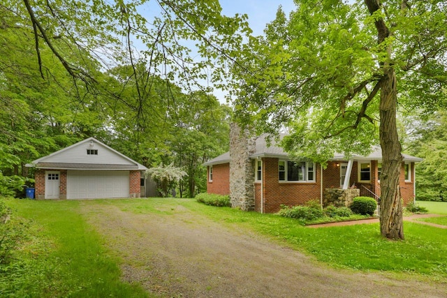 65 Hortontown Rd, Carmel, NY 10512 - view of front of property featuring an outbuilding, driveway, brick siding, a front yard, and a detached garage