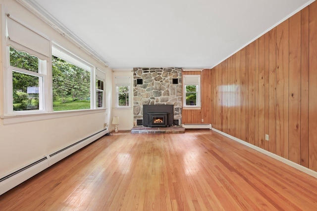 65 Hortontown Rd, Carmel, NY 10512 - unfurnished living room with a baseboard heating unit, hardwood / wood-style floors, ornamental molding, and wood walls