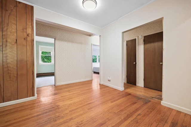 65 Hortontown Rd, Carmel, NY 10512 - empty room featuring light wood-style floors, crown molding, and radiator