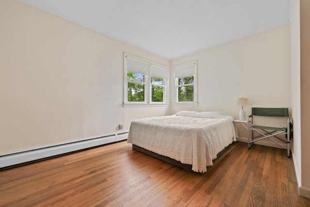 65 Hortontown Rd, Carmel, NY 10512 - bedroom with wood finished floors and a baseboard radiator