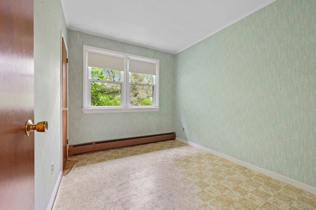 65 Hortontown Rd, Carmel, NY 10512 - empty room featuring a baseboard heating unit, tile patterned floors, ornamental molding, and wallpapered walls